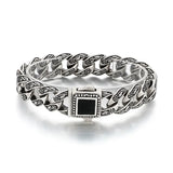 

bracelet homme acier motif gravé, bracelet baroque, bracelet vintage acier argent vieilli, bracelet homme pierre noire, bracelet tribal moderne, bijou masculin fleur de lys, bracelet fort style médiéval