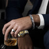 Le Bracelet Luxury Nacre Tungstène allie élégance, style et bien-être. Fabriqué à partir de tungstène de haute qualité et agrémenté de coquille naturelle et d'hématite